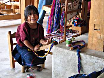 Child learning to weave